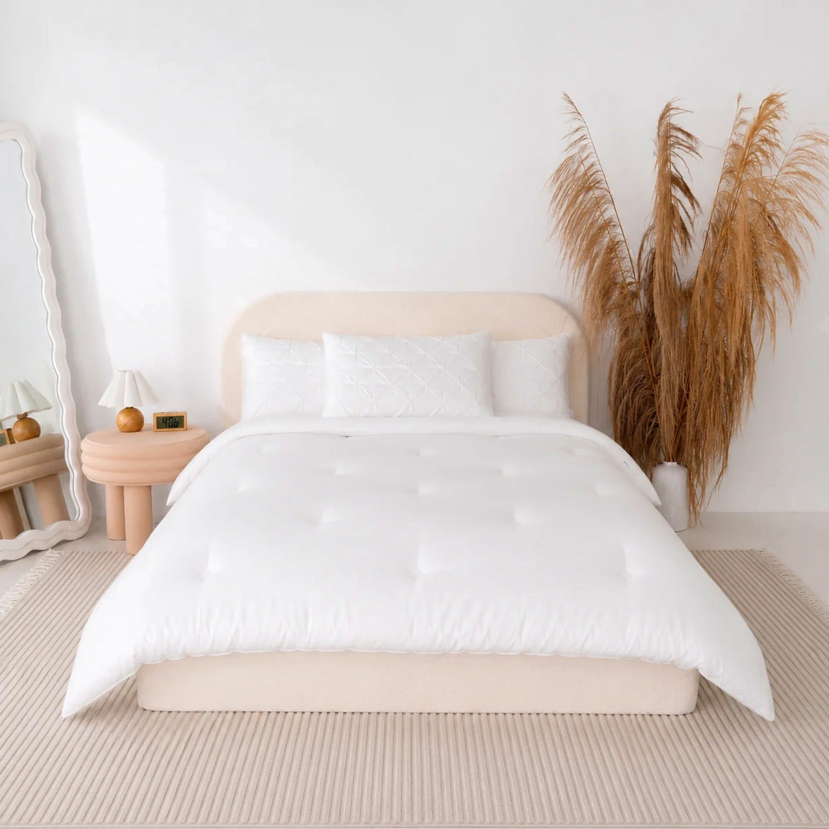 Mochi Mellow Cloud comforter in White on a made bed