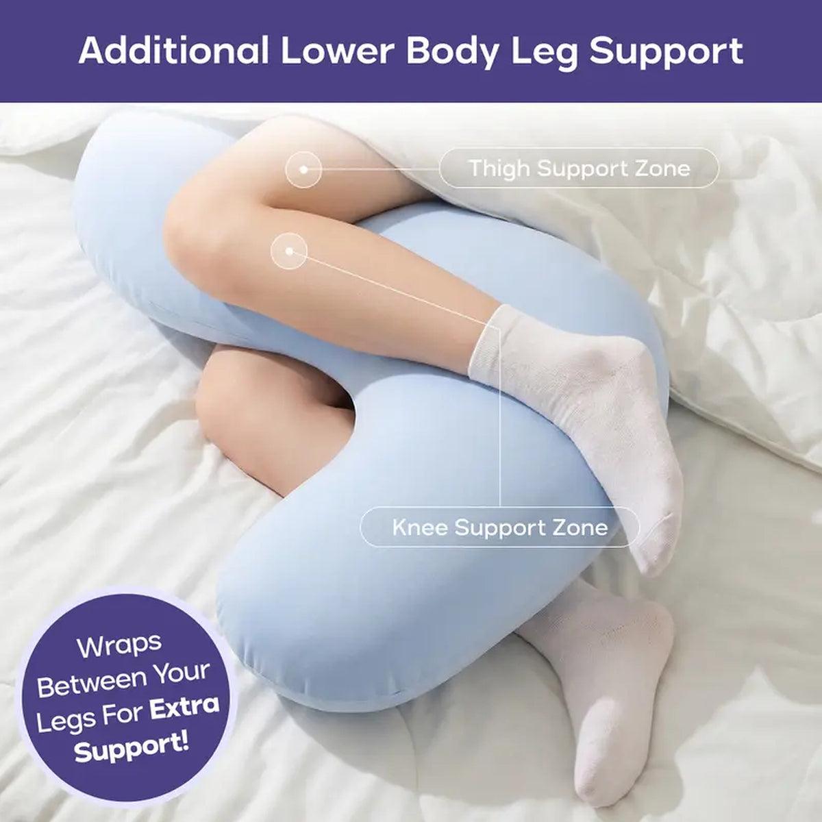 Light Blue body pillow wrapped between a sleeper's thighs and knees, holding the legs apart