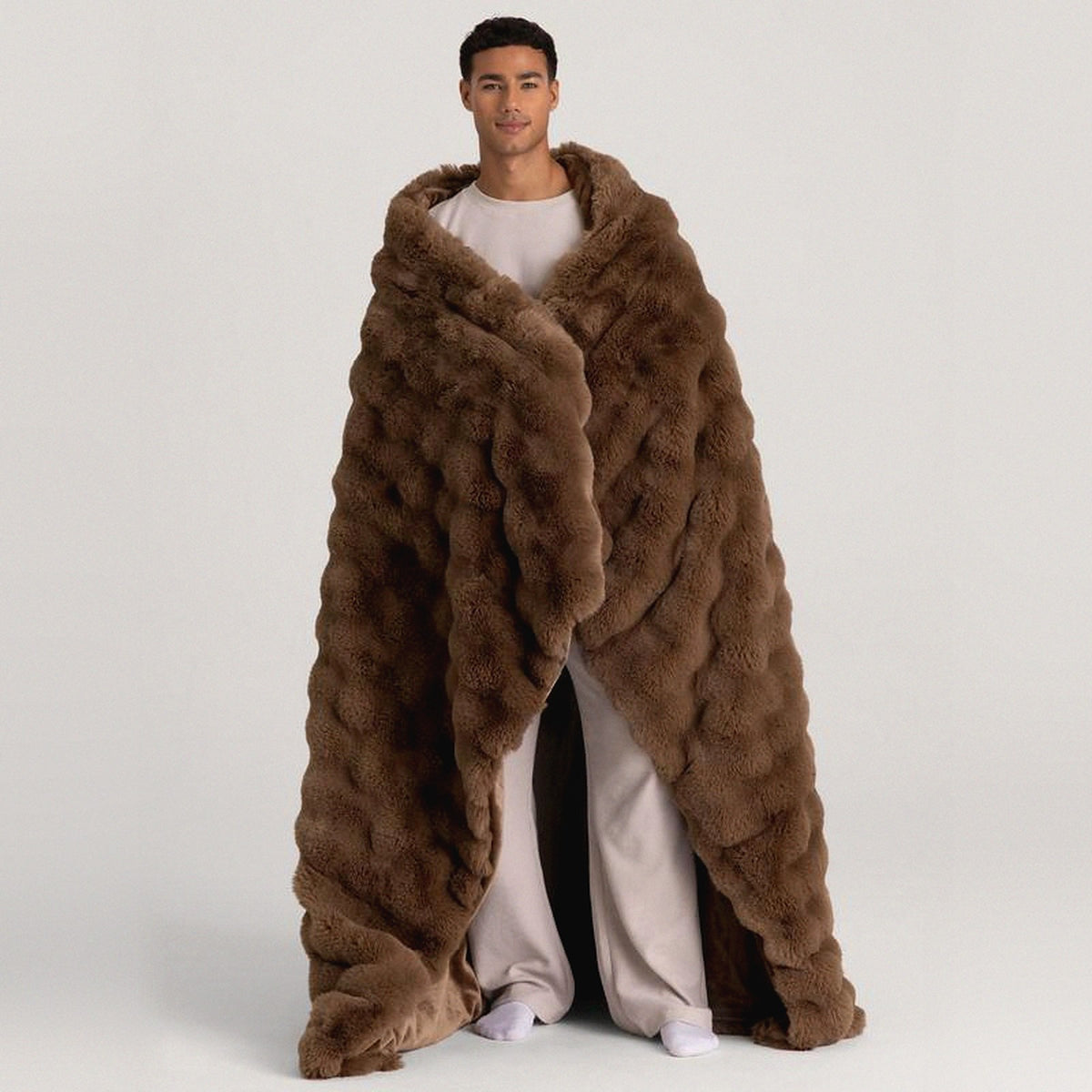 Mochi Mellow Cloud Heated Lavender Throw in Mocha — Mocha heated lavender throw wrapped around a man's shoulders, trailing to the floor