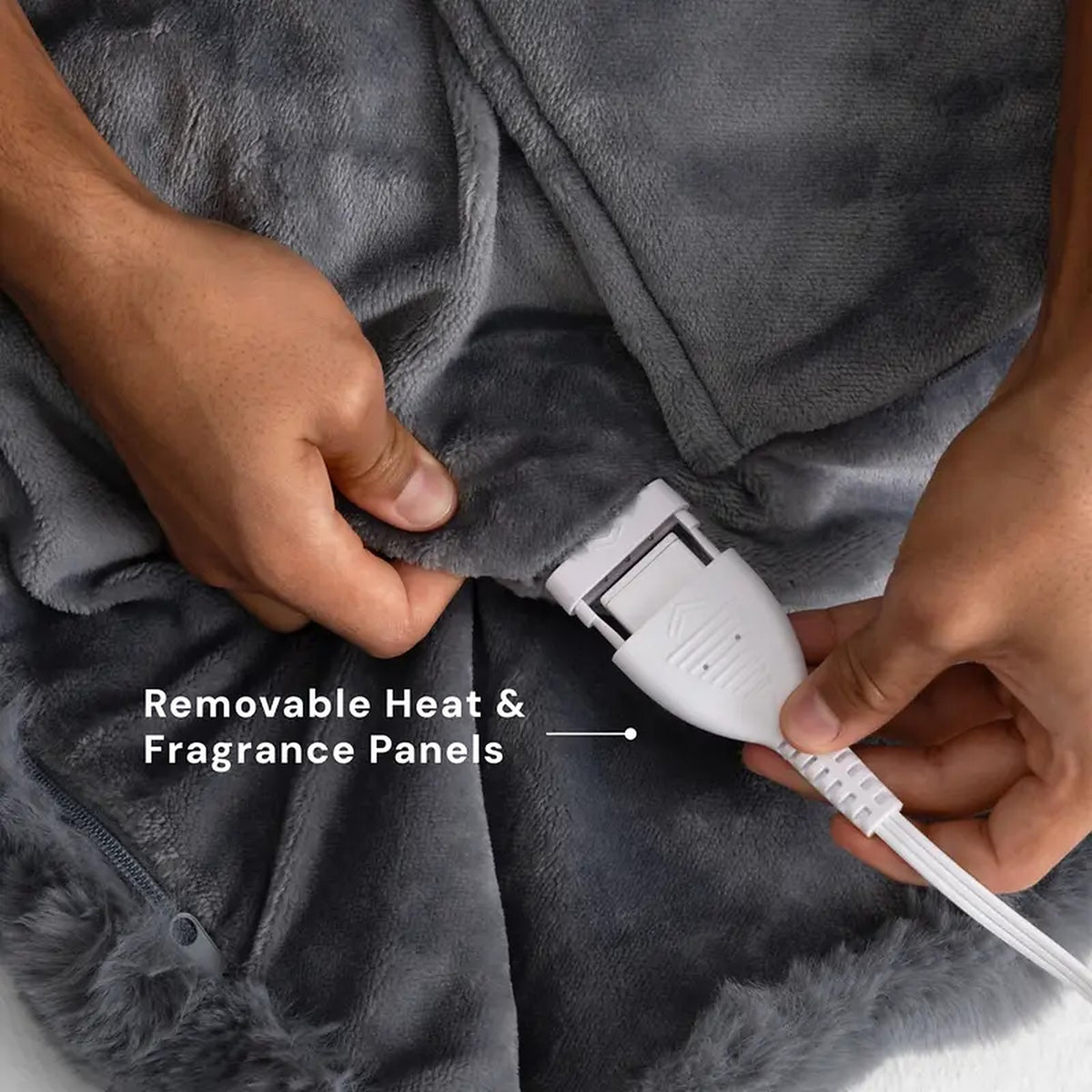 Mochi Mellow Cloud Heated Lavender Throw — Close-up of the zip pocket and connector: the heat and fragrance panels are removable