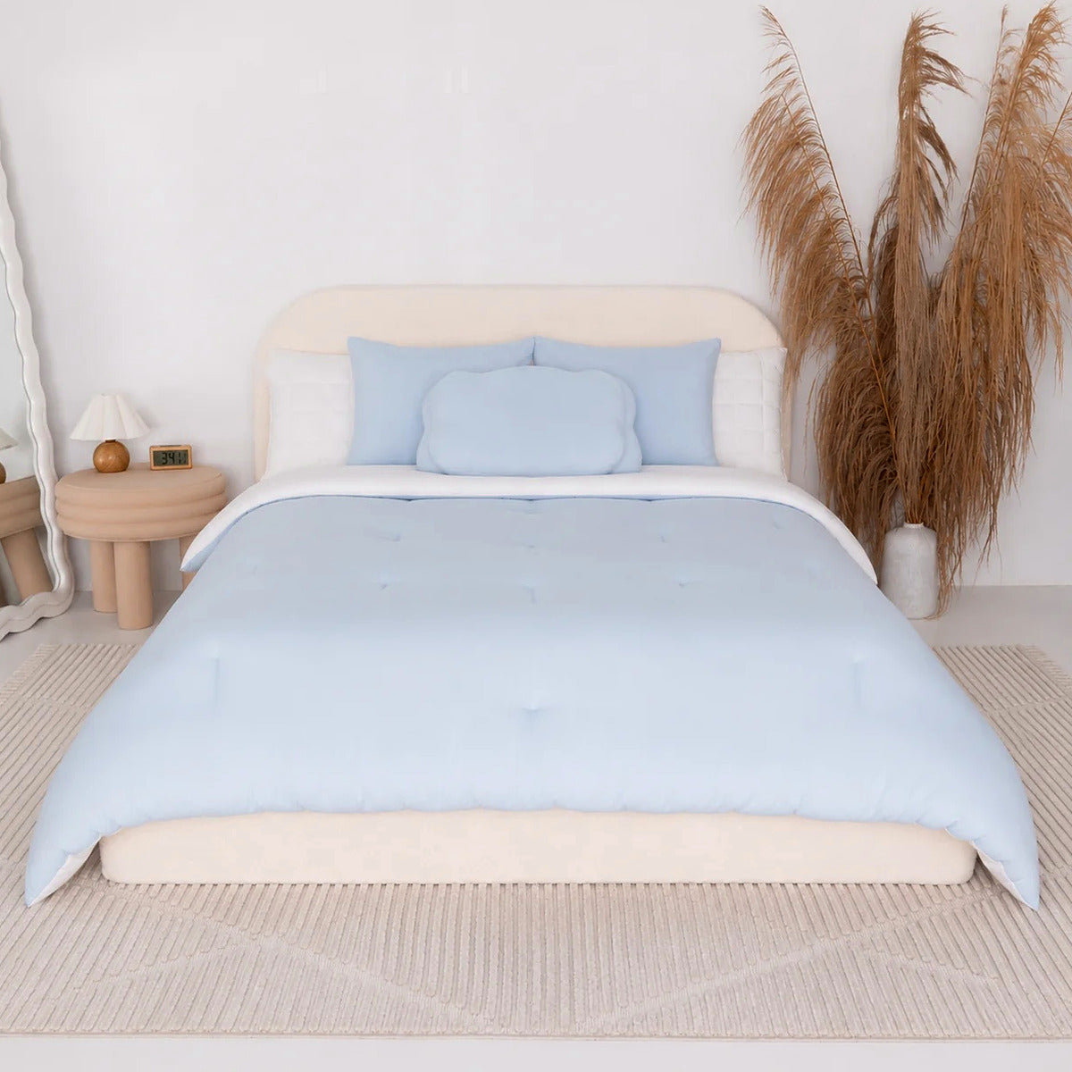 Mochi Mellow Cloud comforter in Baby Blue on a made bed