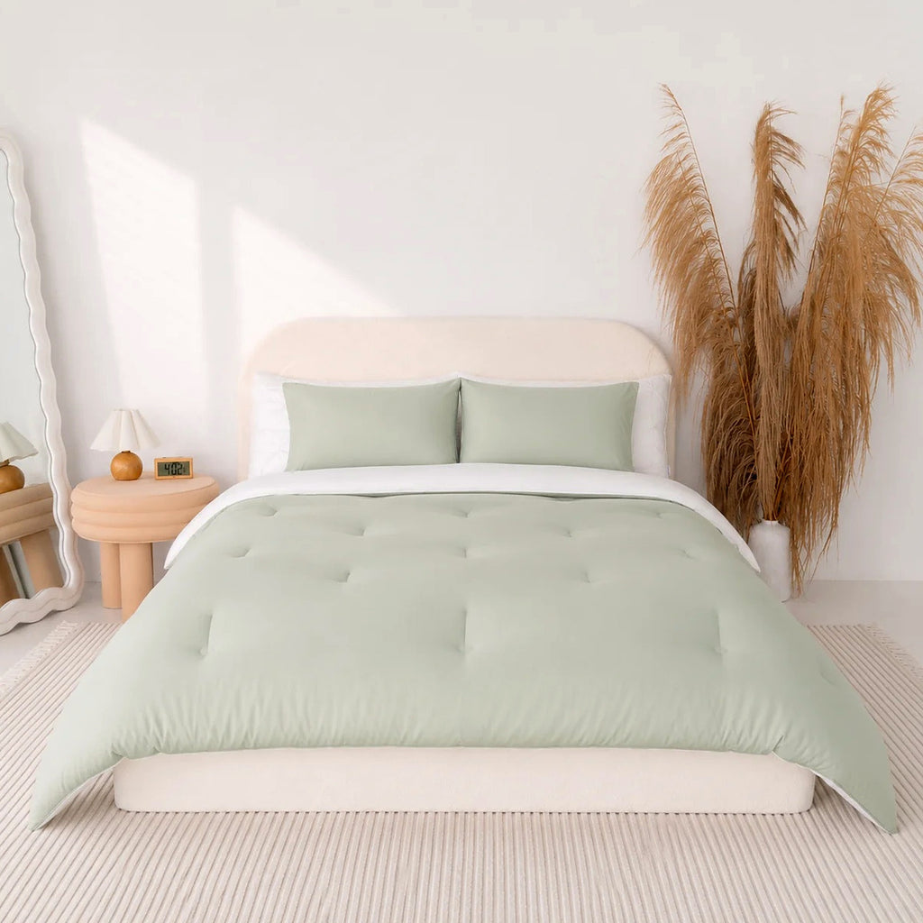 Mochi Mellow Cloud comforter in Sage on a made bed