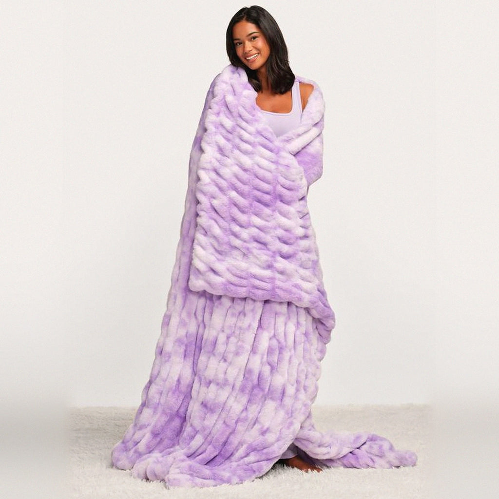Mochi Mellow Cloud Throw in Lavender Marble — Lavender marble ruched faux-fur throw wrapped around a woman, trailing to the floor