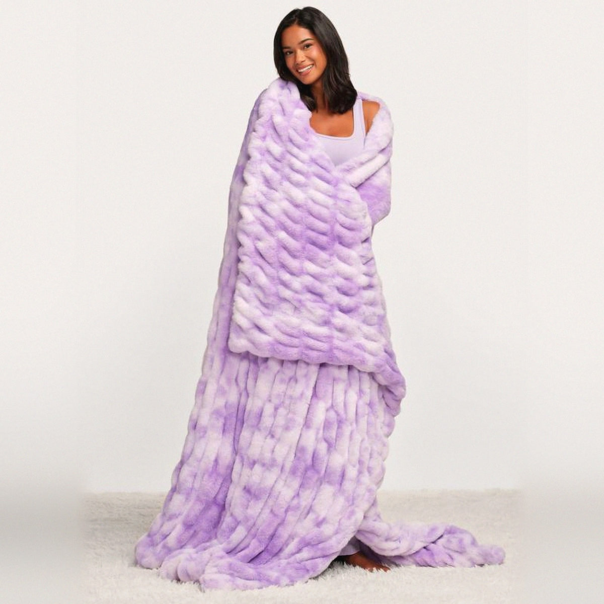 Mochi Mellow Cloud Throw in Lavender Marble — Lavender marble ruched faux-fur throw wrapped around a woman, trailing to the floor
