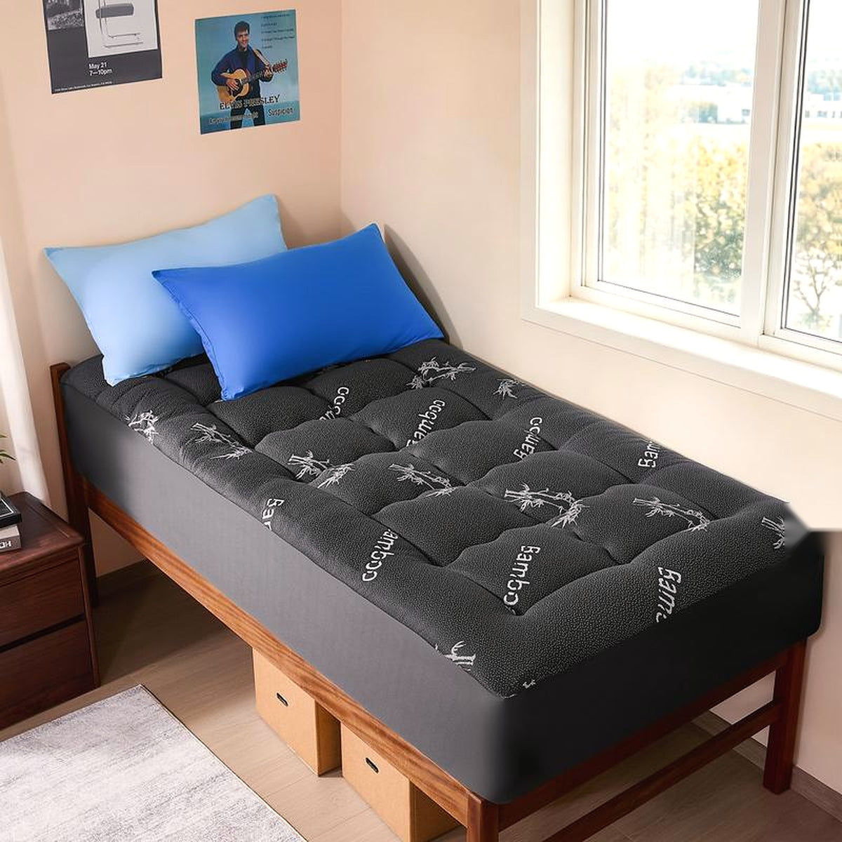 Black topper on a twin bed — the stretch skirt wraps a standard mattress