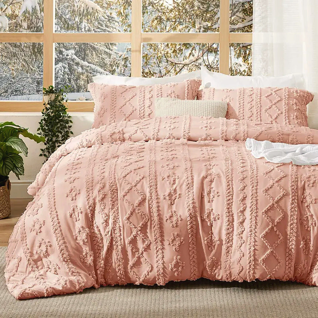 Mochi Mellow Cloud Tufted Comforter Set in Blush on a made bed, with the two matching tufted pillow shams