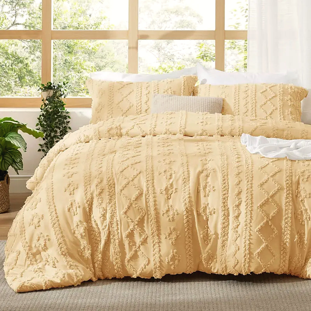 Mochi Mellow Cloud Tufted Comforter Set in Butter Yellow on a made bed, with the two matching tufted pillow shams