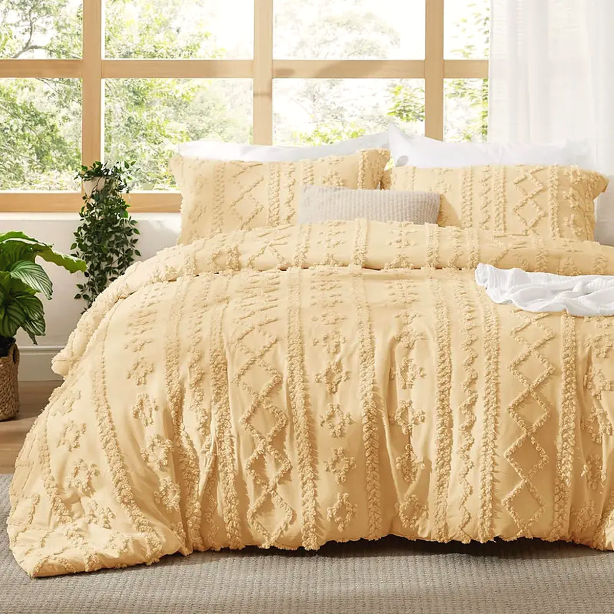 Mochi Mellow Cloud Tufted Comforter Set in Butter Yellow on a made bed, with the two matching tufted pillow shams
