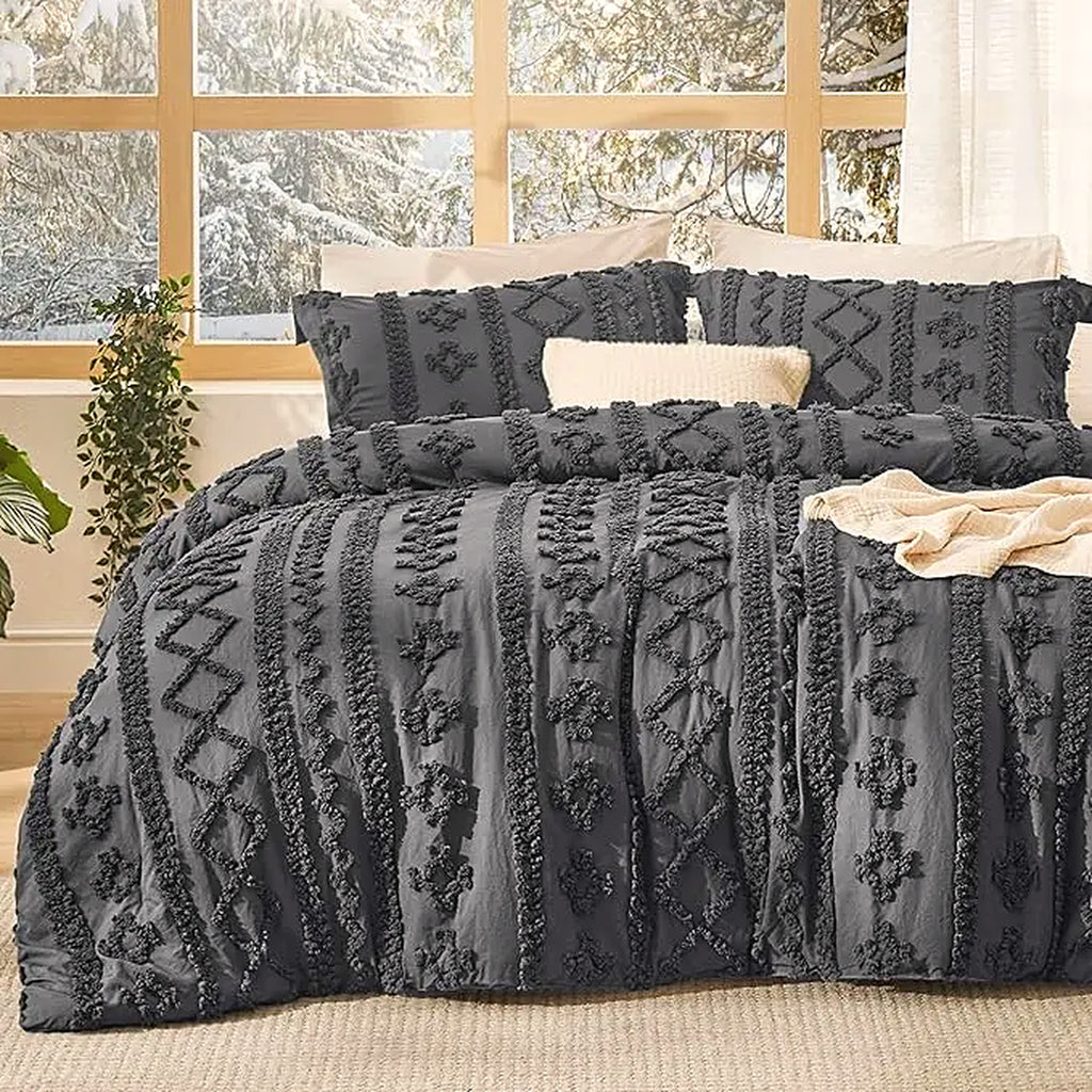 Mochi Mellow Cloud Tufted Comforter Set in Charcoal on a made bed, with the two matching tufted pillow shams