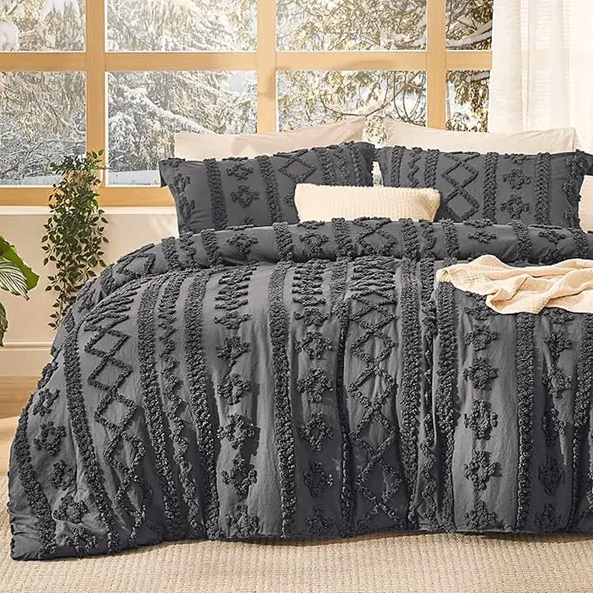 Mochi Mellow Cloud Tufted Comforter Set in Charcoal on a made bed, with the two matching tufted pillow shams