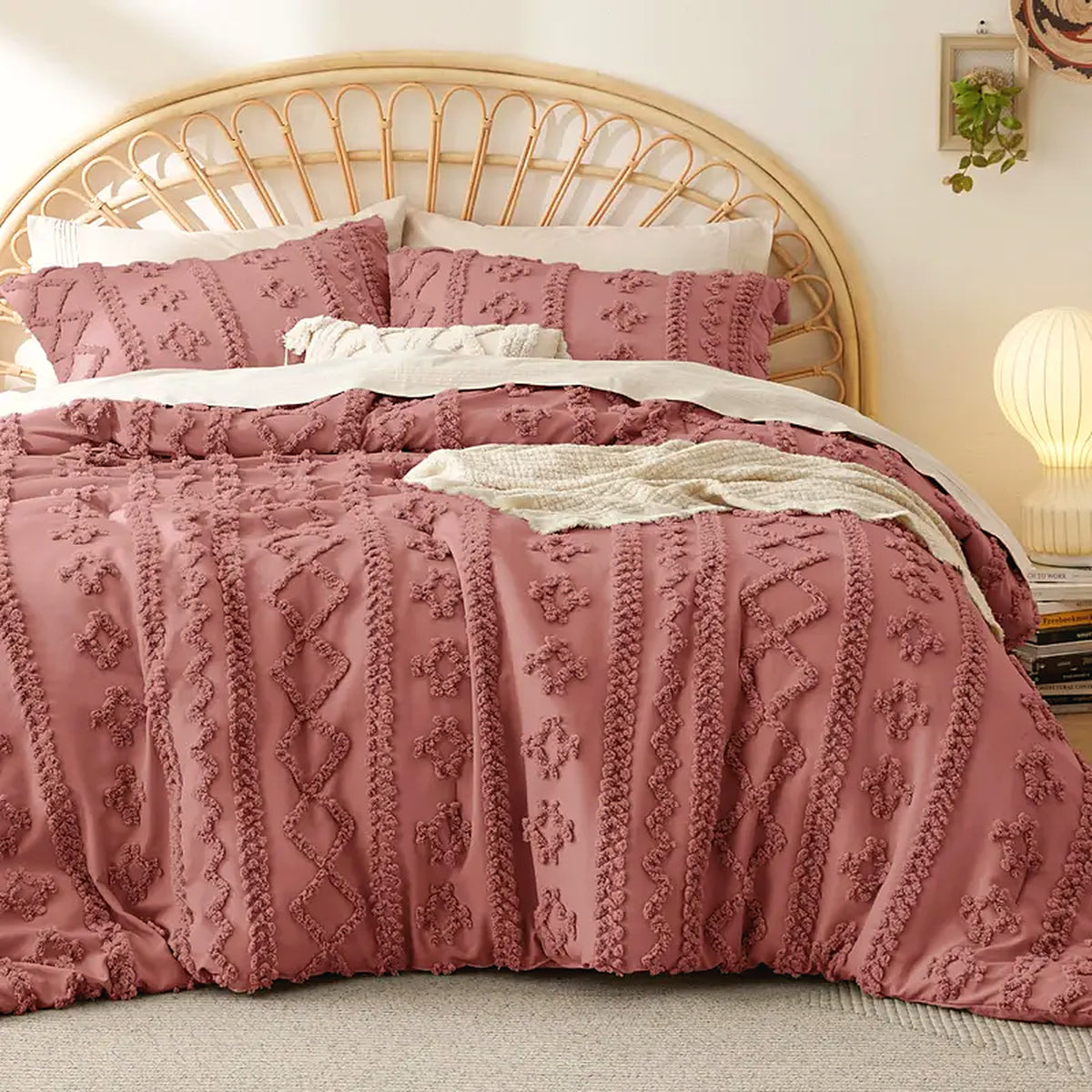 Mochi Mellow Cloud Tufted Comforter Set in Rose on a made bed, with the two matching tufted pillow shams