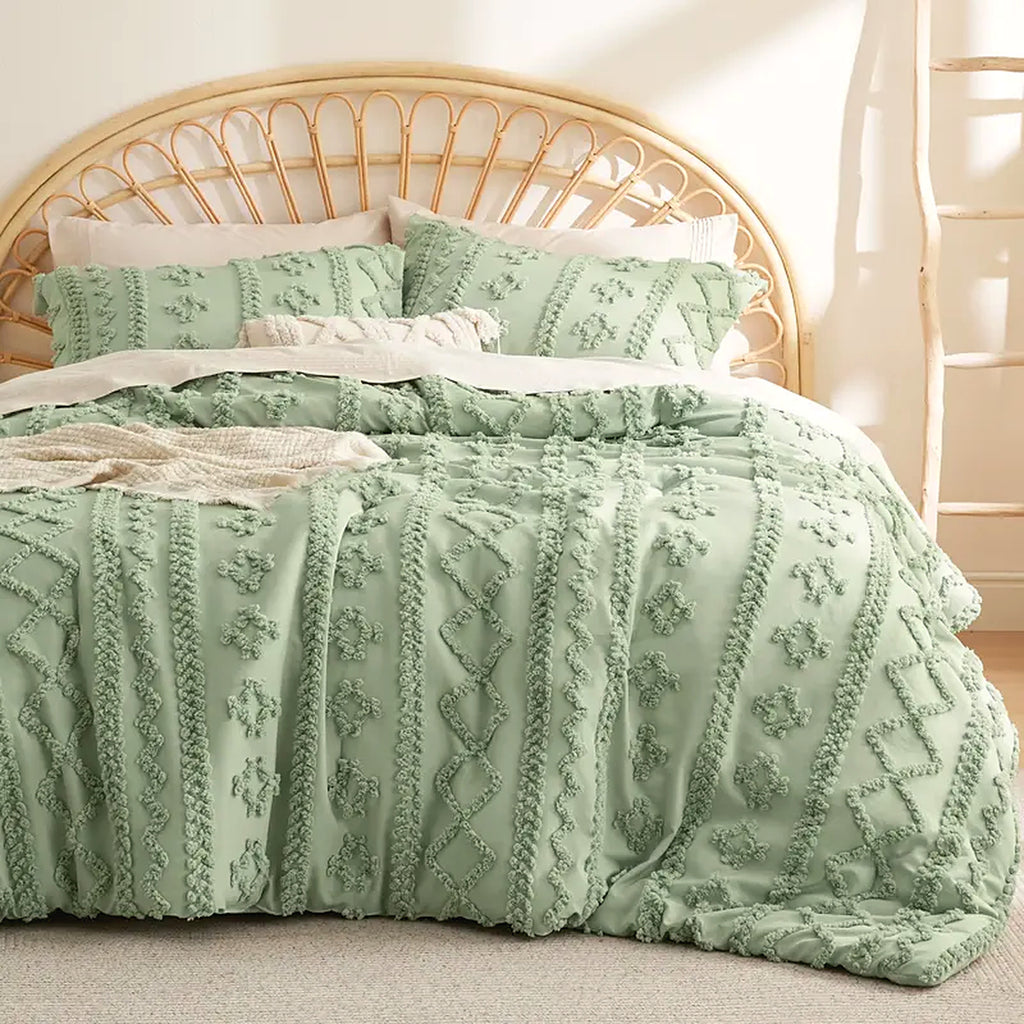 Mochi Mellow Cloud Tufted Comforter Set in Sage on a made bed, with the two matching tufted pillow shams