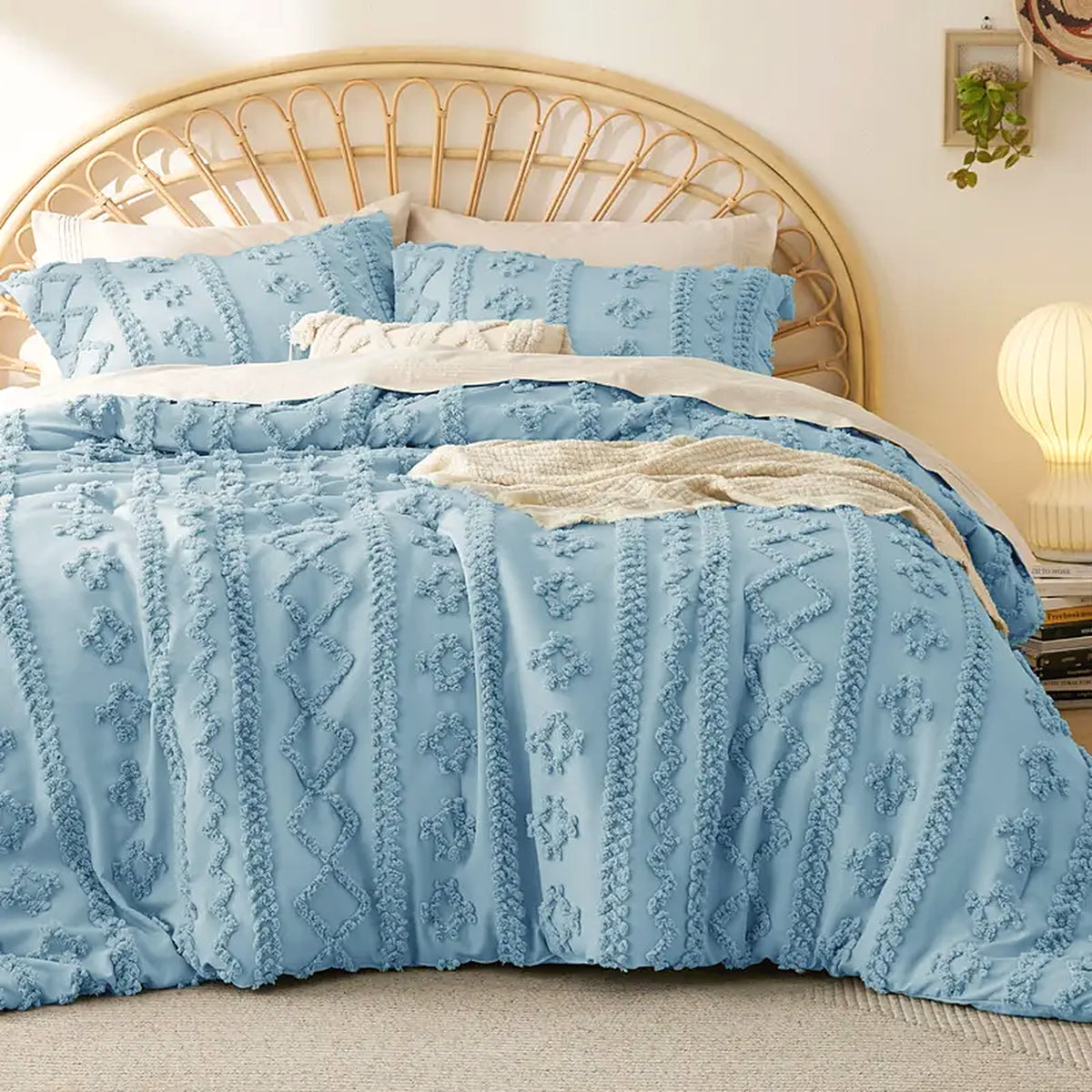 Mochi Mellow Cloud Tufted Comforter Set in Sky Blue on a made bed, with the two matching tufted pillow shams