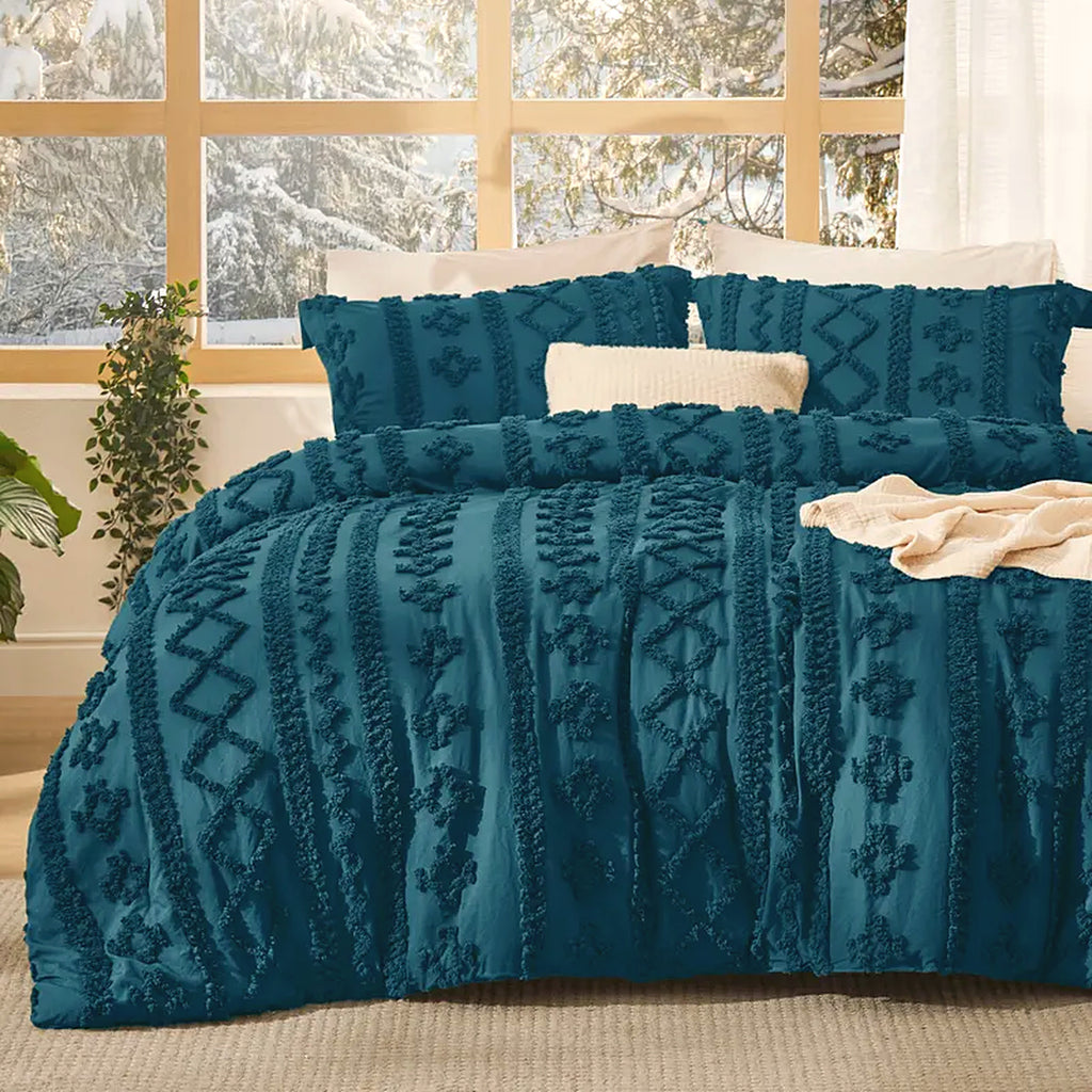 Mochi Mellow Cloud Tufted Comforter Set in Teal on a made bed, with the two matching tufted pillow shams